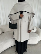 Leather trimmed coat with scarf